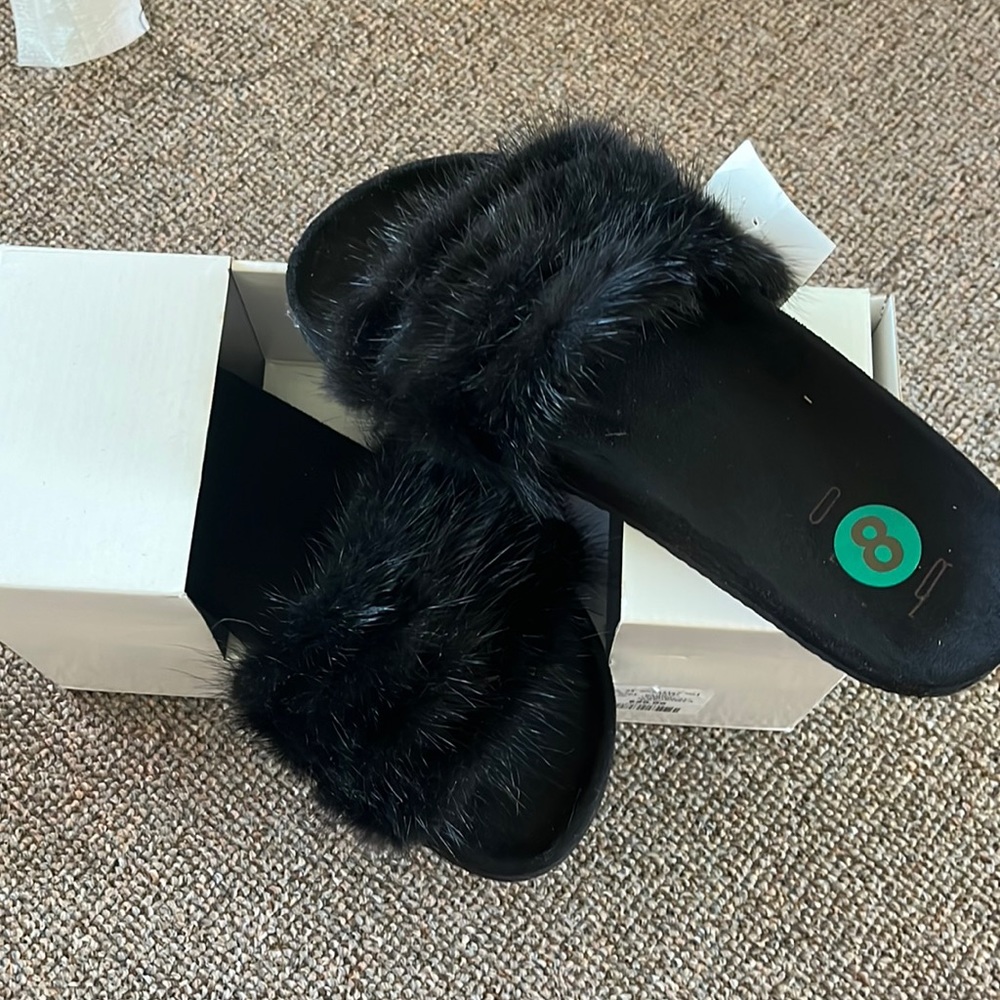 Black slipper style shoe with faux fur top